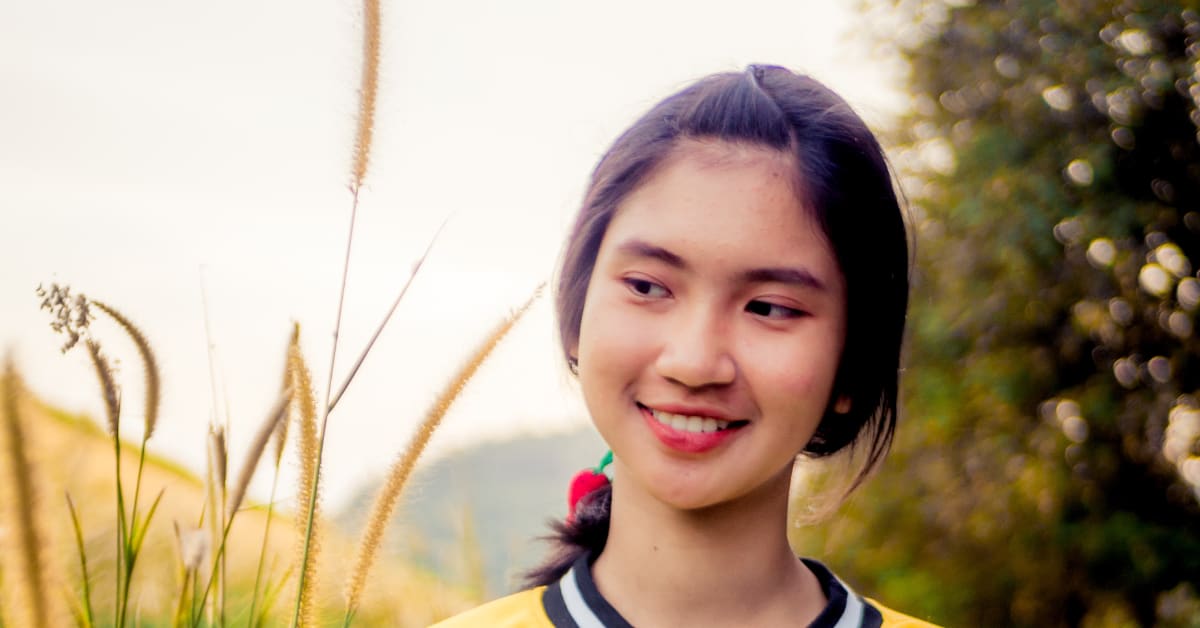 Young thai woman in field